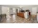 A spacious living room with hardwood floors, a ceiling fan, and views of the front yard at 22025 Torrence Chapel Rd, Cornelius, NC 28031