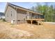 A backyard deck with a view of trees offering a relaxing outdoor space at 2518 Glenwood St, Kannapolis, NC 28083