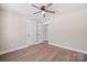 Bedroom featuring wood-look flooring and two white doors at 2518 Glenwood St, Kannapolis, NC 28083