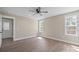 This bedroom offers a fan, wood flooring, and great natural light at 2518 Glenwood St, Kannapolis, NC 28083