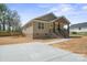 Newly constructed house with a spacious driveway and a deck for outdoor enjoyment at 2518 Glenwood St, Kannapolis, NC 28083