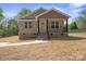 Charming single-story home with a welcoming front porch and well-manicured lawn at 2518 Glenwood St, Kannapolis, NC 28083