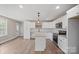 Modern kitchen featuring white cabinets, stainless steel appliances, and a center island at 2518 Glenwood St, Kannapolis, NC 28083