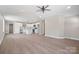 Spacious living room with open concept to the kitchen and wood floors at 2518 Glenwood St, Kannapolis, NC 28083