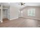 Bright living room with wood floors, neutral paint, and a ceiling fan at 2518 Glenwood St, Kannapolis, NC 28083