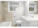 Bathroom with vanity, toilet, tub, and tiled shower at 2815 Grimes St, Charlotte, NC 28206