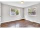 Bedroom featuring updated flooring, neutral walls and dual windows to let in natural light at 2815 Grimes St, Charlotte, NC 28206