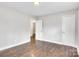 Bedroom featuring neutral walls and updated flooring with access to two closets and a view of the backyard at 2815 Grimes St, Charlotte, NC 28206