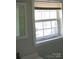 Bright bathroom featuring a window and framed mirror, offering natural light and a view at 2822 Royston Rd, Charlotte, NC 28208