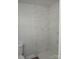 This bathroom is highlighted by a new white tile shower, and modern fixtures at 2822 Royston Rd, Charlotte, NC 28208