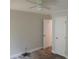 This bedroom has a ceiling fan and an open doorway at 2822 Royston Rd, Charlotte, NC 28208