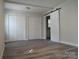 Bedroom with vinyl floors, three closets and a sliding door at 2822 Royston Rd, Charlotte, NC 28208