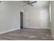 A well lit bedroom with vinyl floors, fan, and neutral colored walls at 2822 Royston Rd, Charlotte, NC 28208