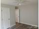 This bedroom includes two doors and newly-installed flooring at 2822 Royston Rd, Charlotte, NC 28208