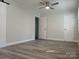 Bedroom with vinyl floors, fan, and neutral colored walls at 2822 Royston Rd, Charlotte, NC 28208