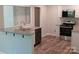This kitchen has newly-installed stainless-steel appliances, granite countertops, and a modern faucet at 2822 Royston Rd, Charlotte, NC 28208