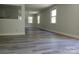 The open-concept living room features light-colored walls, new flooring, and lots of natural light at 2822 Royston Rd, Charlotte, NC 28208
