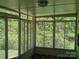 Sunroom with large windows providing lots of natural light and views of nature, perfect for relaxation and enjoyment at 2822 Royston Rd, Charlotte, NC 28208