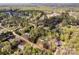 Aerial view shows a home nestled in a verdant neighborhood, framed by mature trees and landscaping at 2895 Sweeping Pine Ln, Denver, NC 28037