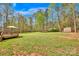 Spacious backyard with a large deck, shed, and lush greenery; perfect for outdoor living at 2895 Sweeping Pine Ln, Denver, NC 28037