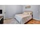 Cozy bedroom with neutral decor, a comfortable bed, and hardwood flooring at 2895 Sweeping Pine Ln, Denver, NC 28037