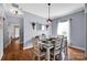 Dining room with table and chairs, hardwood floors, and neutral wall color at 2895 Sweeping Pine Ln, Denver, NC 28037