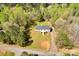 Aerial shot of a charming home with a well-maintained lawn and a driveway leading to the street at 2895 Sweeping Pine Ln, Denver, NC 28037