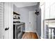 Laundry room with modern washer and dryer units and an exterior view at 2895 Sweeping Pine Ln, Denver, NC 28037