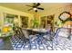 Covered back patio features an inviting dining area, decorative rugs, and stylish decor for relaxing and entertaining guests at 316 Country Club Acres None, Shelby, NC 28150