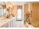 Bathroom featuring a long vanity with double sinks, a tub and a separate shower at 316 Country Club Acres None, Shelby, NC 28150