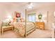 Charming bedroom with a four-poster bed, floral comforter and a large window for natural light at 316 Country Club Acres None, Shelby, NC 28150