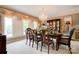 Formal dining room featuring an elegant chandelier and large windows with custom drapery at 316 Country Club Acres None, Shelby, NC 28150