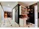Hallway with stylish black walls, marble floors, and a vintage desk at 316 Country Club Acres None, Shelby, NC 28150
