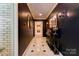 Hallway featuring black walls, marble floors, and decorative mirrors at 316 Country Club Acres None, Shelby, NC 28150