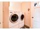 Functional laundry room with a washer and dryer set and extra storage space at 316 Country Club Acres None, Shelby, NC 28150