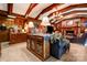 Spacious living room with wood paneling, stone fireplace, and beautiful wood ceiling beams at 316 Country Club Acres None, Shelby, NC 28150
