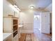 Bright bathroom with hardwood floors, a pedestal sink, and a separate room for toilet and shower at 3241 Long Shoals Rd, Lincolnton, NC 28092