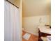 Cozy bathroom with a shower, classic vanity with a marble countertop, and hardwood floors at 3241 Long Shoals Rd, Lincolnton, NC 28092