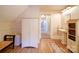 Bright bathroom with wood floors, white cabinets, and sink, offering a clean, classic design at 3241 Long Shoals Rd, Lincolnton, NC 28092