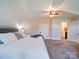 Bright bedroom showcasing plush carpeting, a cozy bed with throw blanket, and lots of natural light at 3241 Long Shoals Rd, Lincolnton, NC 28092