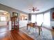 Dining room with hardwood floors, decorative wallpaper, and a view into the kitchen at 3241 Long Shoals Rd, Lincolnton, NC 28092