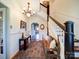 Elegant foyer with a staircase, chandelier, and a decorative rug at 3241 Long Shoals Rd, Lincolnton, NC 28092