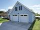 Exterior shot of a house with a large garage, offering parking and storage space at 3241 Long Shoals Rd, Lincolnton, NC 28092
