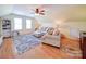 Bright living room with neutral décor, comfortable seating, hardwood floors, and natural light at 3241 Long Shoals Rd, Lincolnton, NC 28092