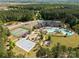 Aerial view of community amenities showcasing a pool, clubhouse, tennis courts, basketball court, and playground area at 3268 Sherman Dr, Lancaster, SC 29720