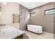 A contemporary bathroom features a freestanding tub, double vanity and a heated towel rack for a spa-like experience at 3268 Sherman Dr, Lancaster, SC 29720