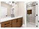 Updated bathroom featuring a double sink vanity and a tiled shower with glass door at 3268 Sherman Dr, Lancaster, SC 29720