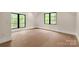 Bright bedroom features wood floors and two windows providing natural light at 3268 Sherman Dr, Lancaster, SC 29720
