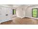 Bedroom featuring a large window, hardwood floors, base molding and ample closet space for organized storage at 3268 Sherman Dr, Lancaster, SC 29720