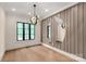Dining room features modern light fixtures and a unique mirror design at 3268 Sherman Dr, Lancaster, SC 29720